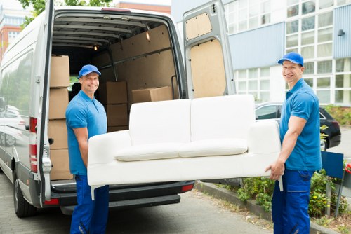 Supervisors reviewing safety procedures for a Belgium moving service
