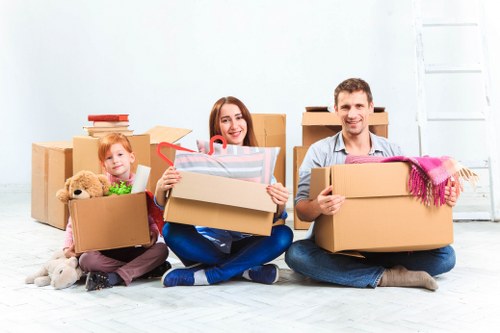 Professional movers loading furniture for a same day move