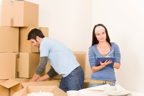 Packing boxes into a moving van for transport